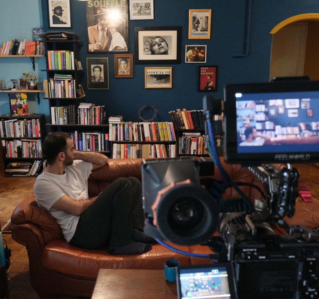 Behind the Scenes – Withered Pomegranates | Piramoon Independent Film Company Behrad Selahvarzi, main actor of Withered Pomegranates, seen through the camera monitor on set – a glimpse into the artistic process of Piramoon, an independent film company.