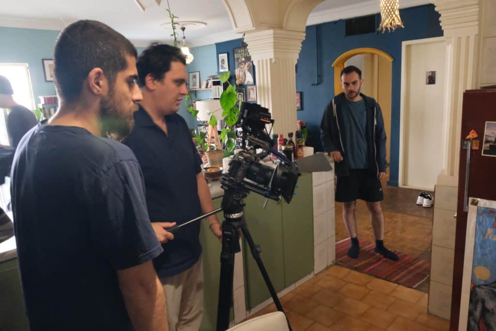 Moein Rahmanzadeh standing next to Shahab Malekpoor, the DOP of the film Withered Pomegranates, and Behrad Selahvarzi the main actor can be seen in the background.